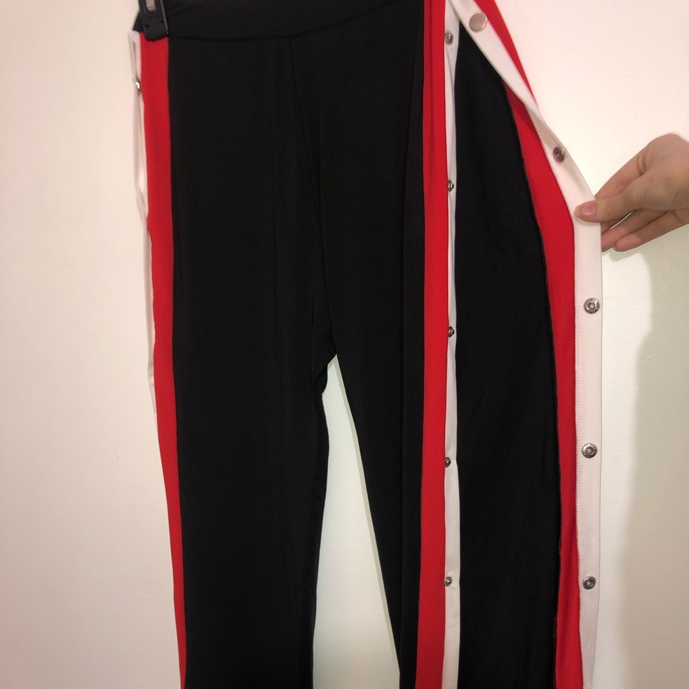 Black Pants with open/closed side slits.